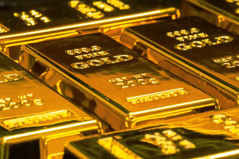 La imagen muestra barras de oro