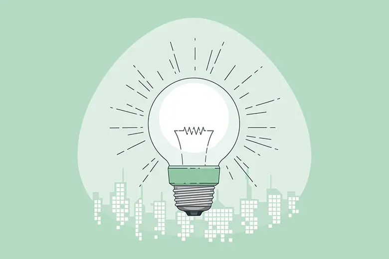 La imagen muestra una ilustración de una bombilla de luz iluminando una ciudad